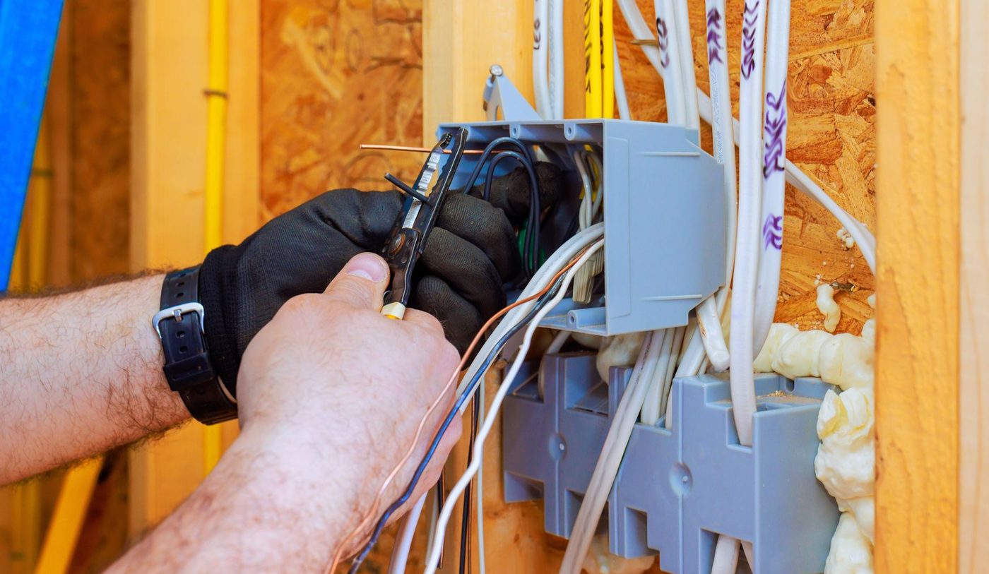 Electrician wiring a junction box